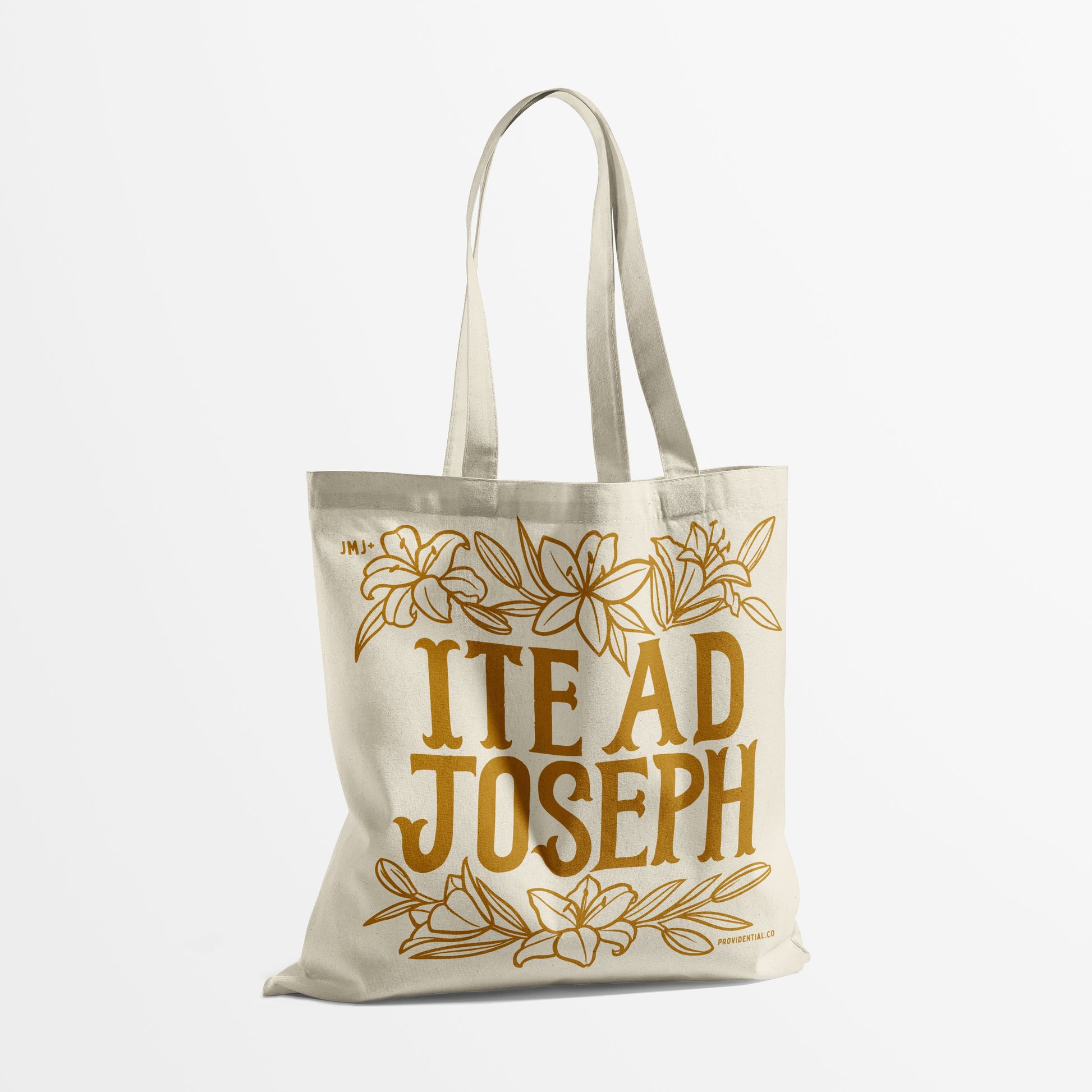 Tote bag with 'ITE AD JOSEPH' text and floral design on a white background